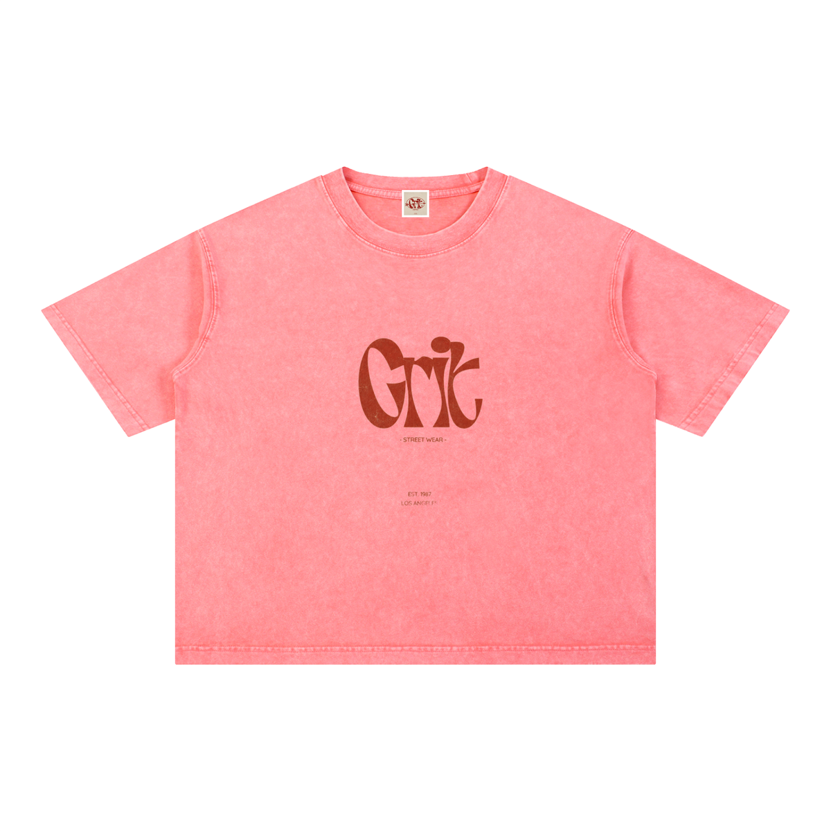 Grit mineral wash boxy cotton t-shirt in pink with a distressed finish, drop shoulders, and front graphic logo.